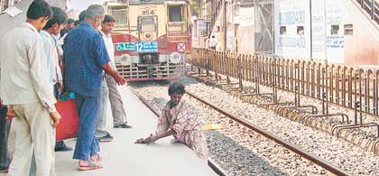 12-coach train passed and the man clambered out, unaided, unhurt